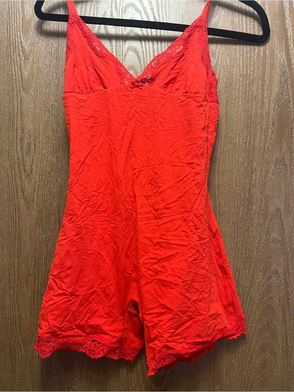 Skims red fits everybody lace trim onesie